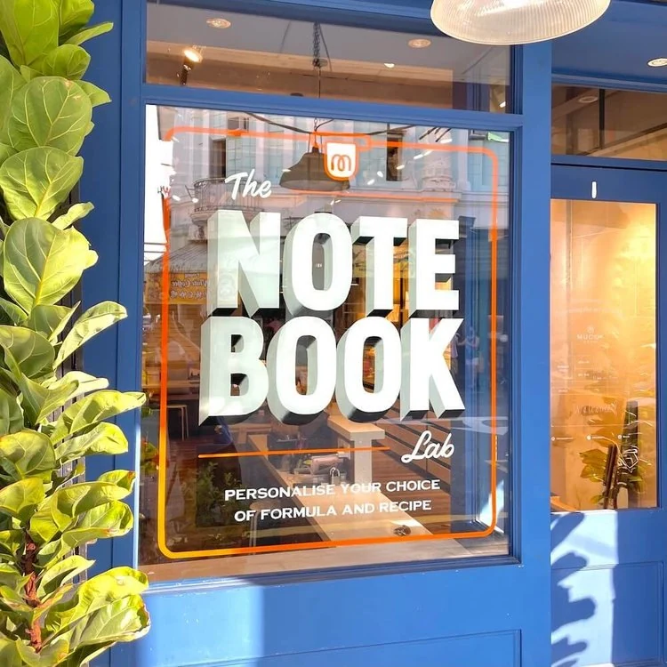 Painted window signage for The Notebook Lab